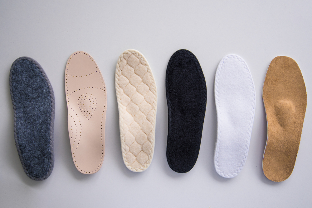 five pairs of foot pads lined up in a row