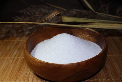 A wooden bowl with Epsom salts inside
