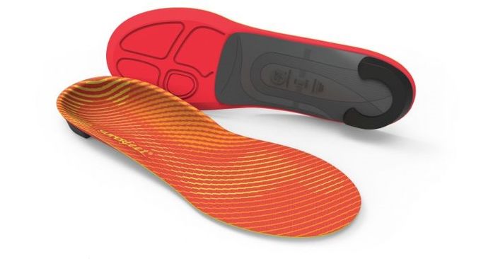 Red and orange striped insoles from Superfeet on display
